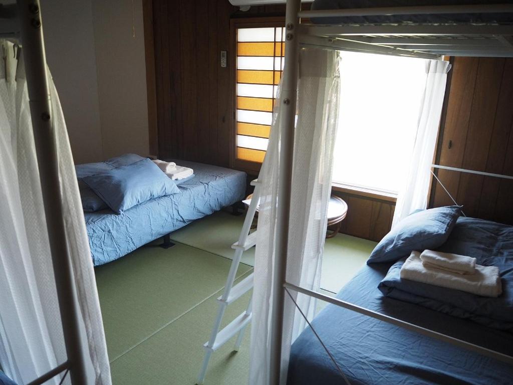 Guesthouse ＆ Beach Cafe Fuego Hyuga Værelse billede